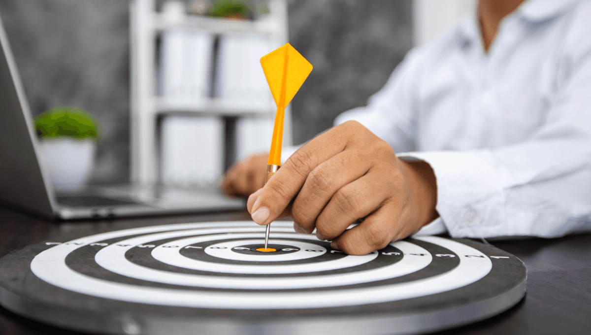 Dart hitting bullseye - representing precision and results